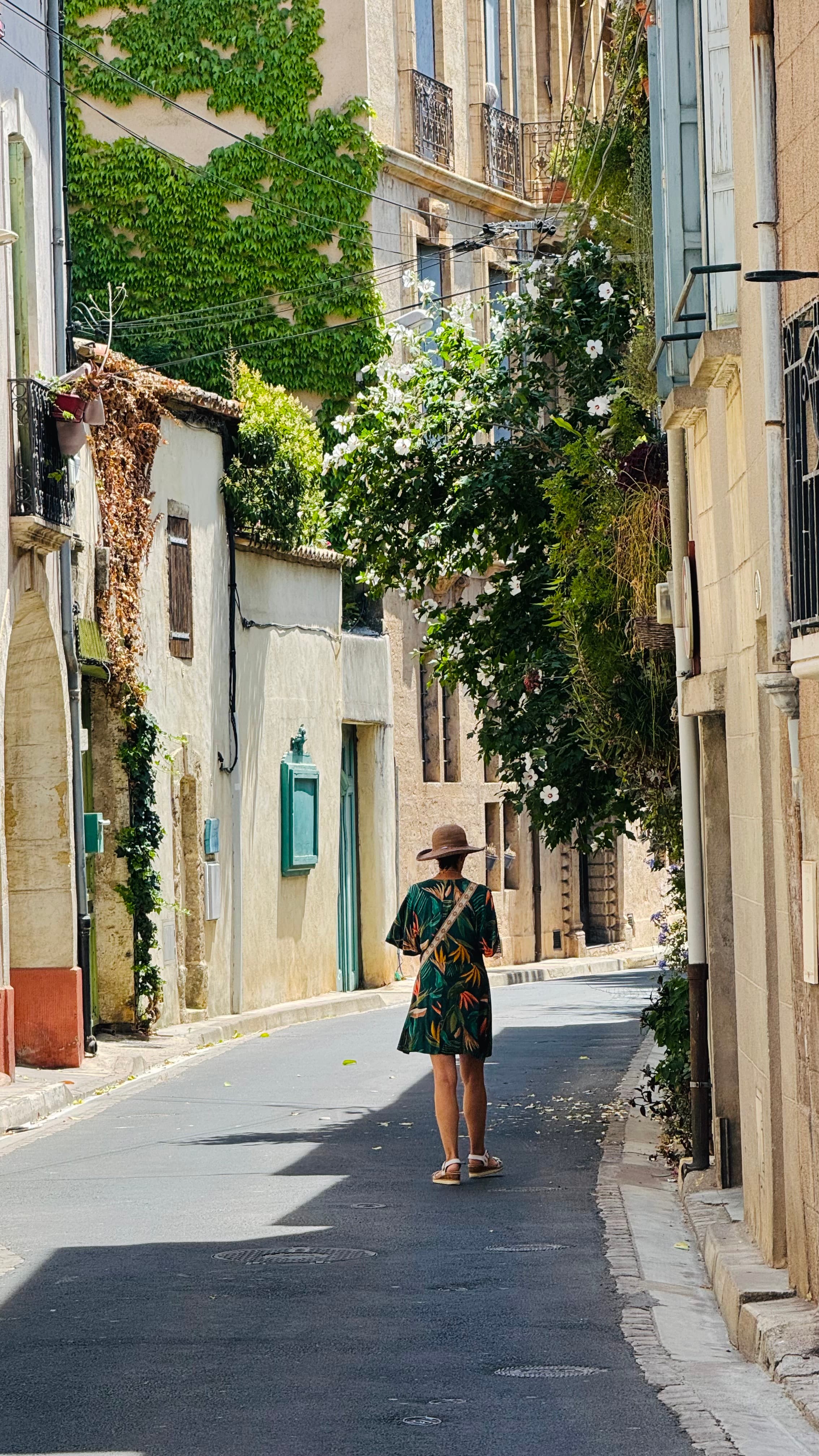 A woman walking the streets of Pézenas. Very sweet little French village. Must see.