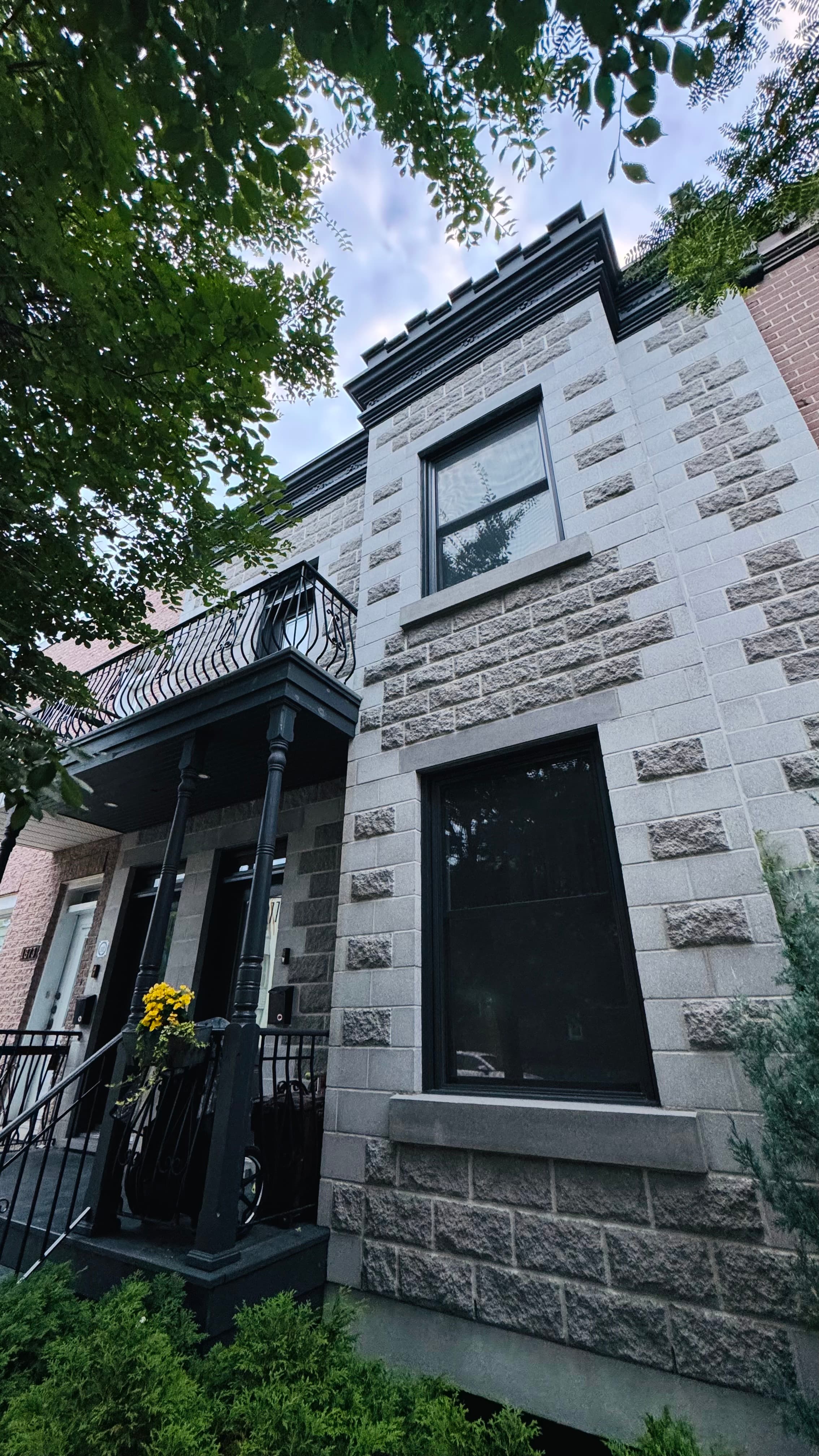 Typical architecture of the Plateau Mont-Royal and part of Rosemont, Montreal. Built around 1890-1900. I think there is some Victorian style to this house (especially the balcony).