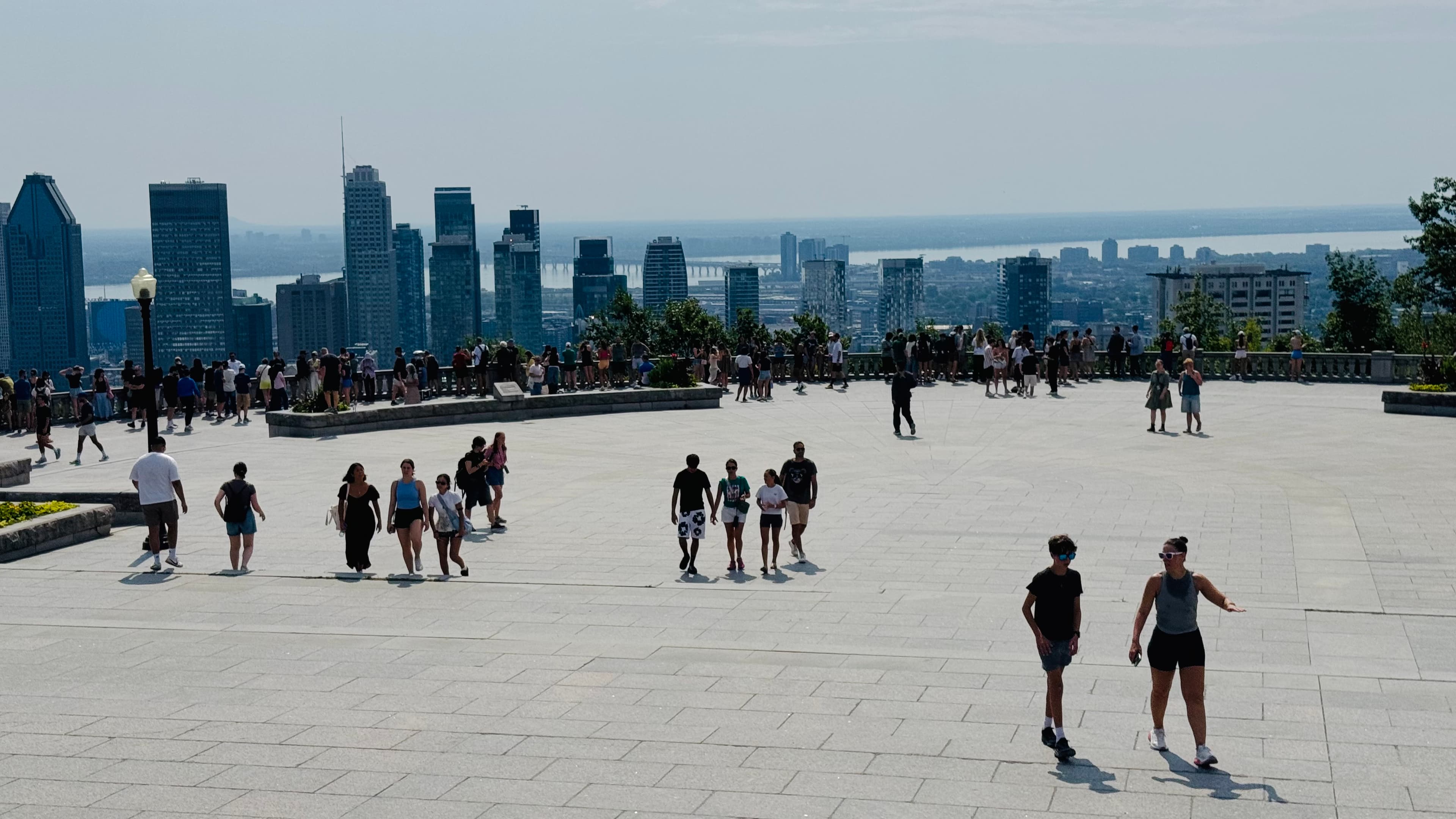 This is the best place to see Montreal city: from the terrace at the top of Mount Royal. I go there many times a year, essentially all seasons except winter. Hot summer day today.