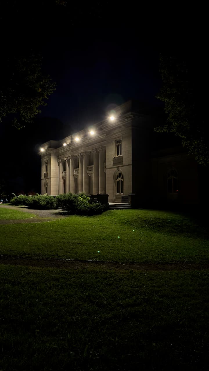 It's an old building on Sherbrooke Street E, near the Olympic Stadium. I often pass it during the day while biking on Rachel Street, but at night it feels different.