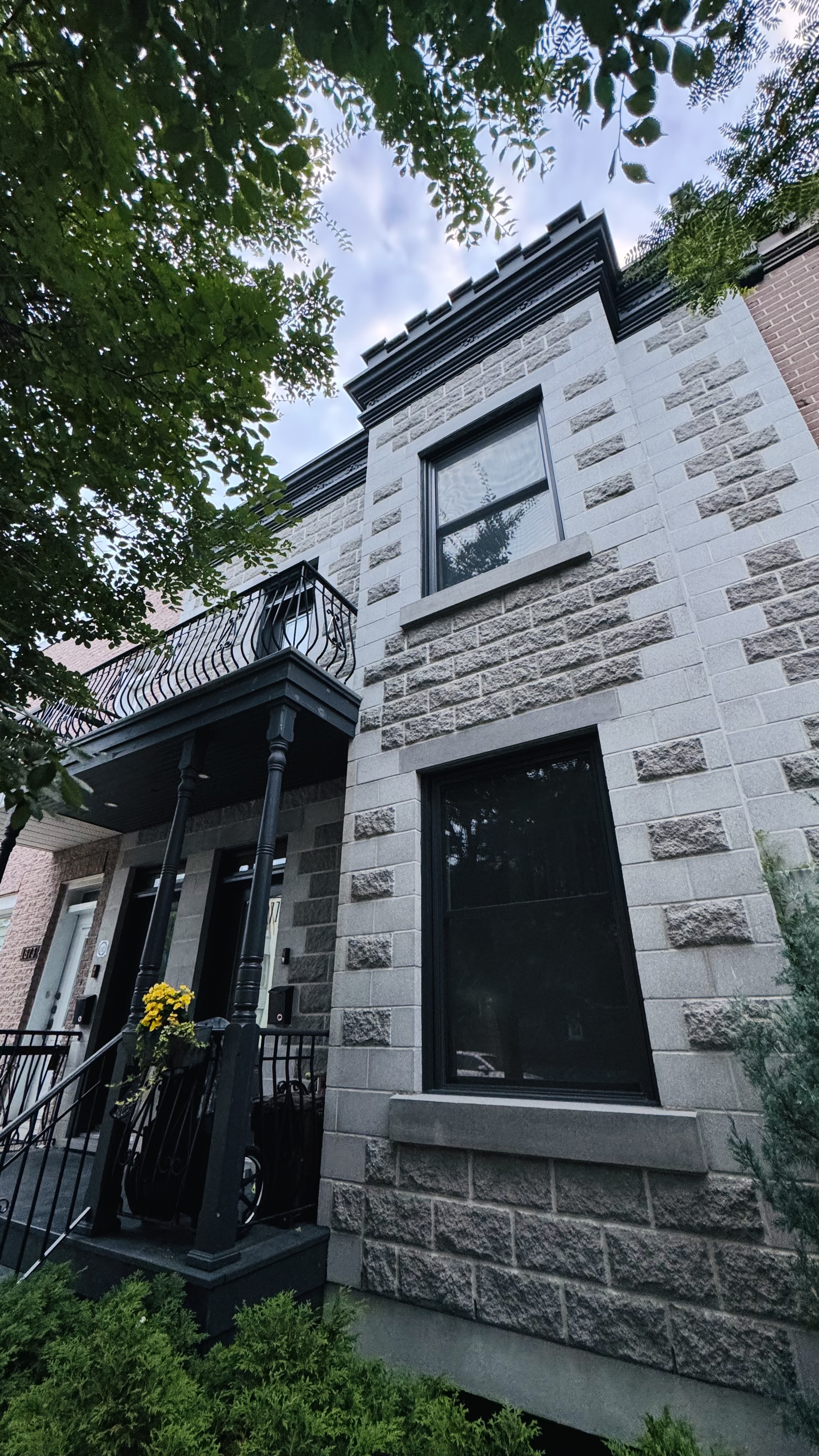 Typical architecture of the Plateau Mont-Royal and part of Rosemont, Montreal. Built around 1890-1900. I think there is some Victorian style to this house (especially the balcony).