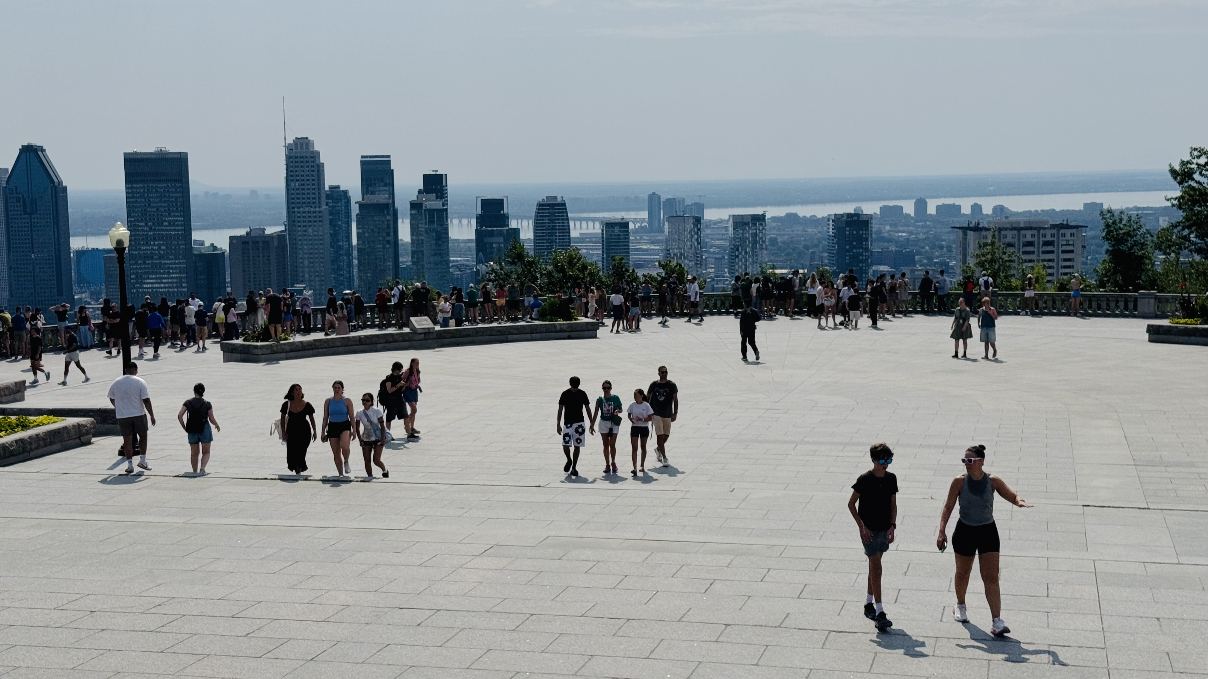 This is the best place to see Montreal city: from the terrace at the top of Mount Royal. I go there many times a year, essentially all seasons except winter. Hot summer day today.
