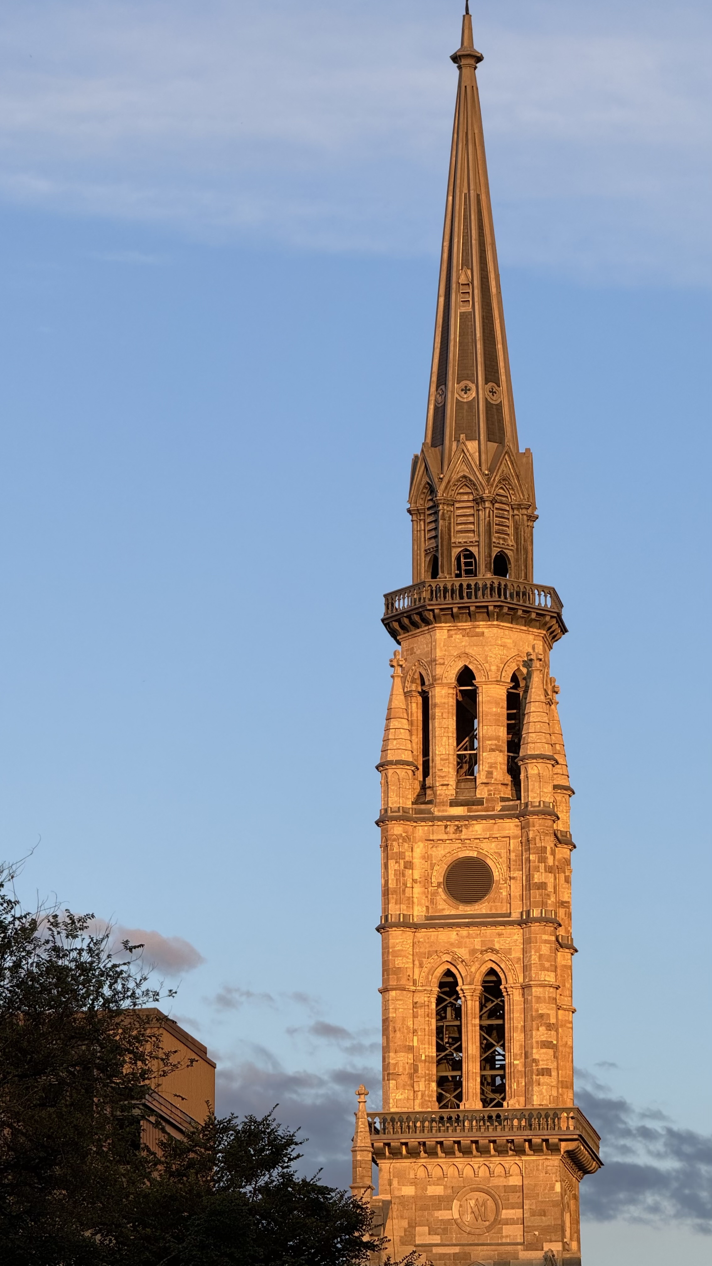 Saw this great bell tower reflecting sunset light, or golden hour light, now part of Montreal well-known university building, named UQAM.